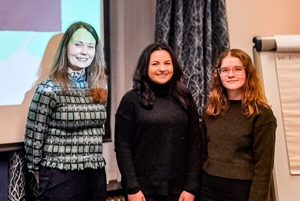Nuvo HR at Prosper Peer Works - Lauren, Elisha and Alison Paton, Stood in front of a screen