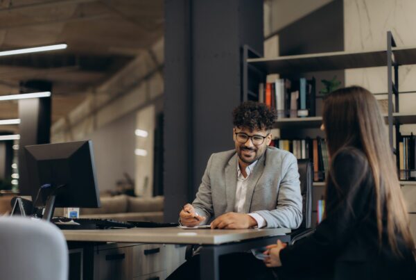 HR manager conducting a probation review meeting with a new employee